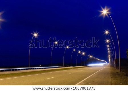 Landscape in the country, it is expensive with lamps going to infinity, the night picture on long endurance