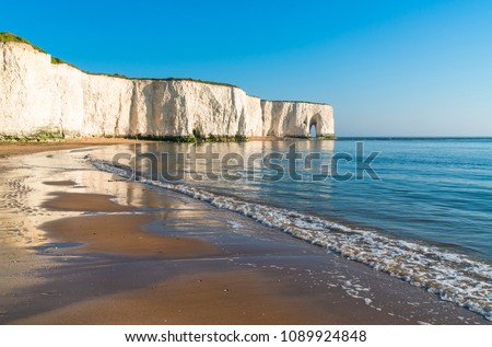 View of sea at low tide and beach in Kingsgate Bay in Margate, UK Royalty-Free Stock Photo #1089924848