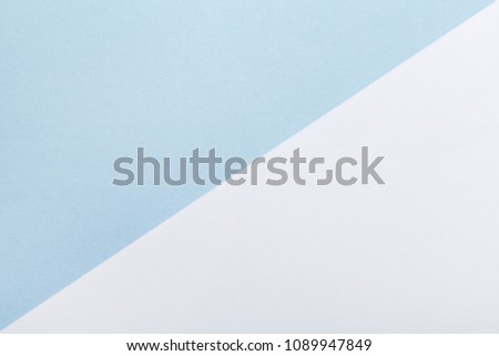 Minimal geometric pastel background. Blue and white paper color in flat lay style.
