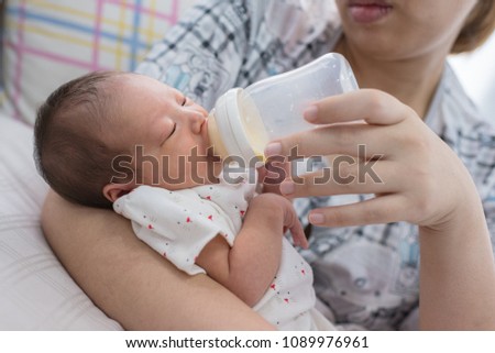 Baby drinking milk bottle