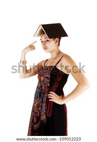 A portrait picture of a student in a dress and an book on her head, for white background and pointing with her finger at the book.