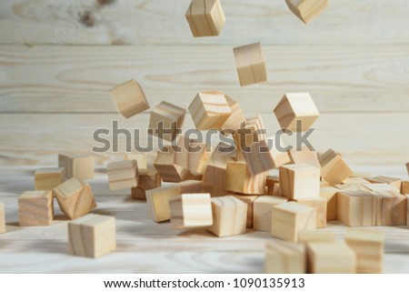 Business concept - Abstract geometric real floating wooden cube float on wood floor white background for display or montage word.