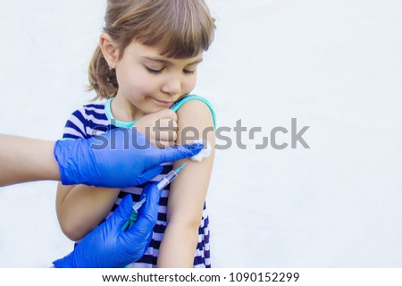 vaccination of children. An injection. Selective focus. Royalty-Free Stock Photo #1090152299
