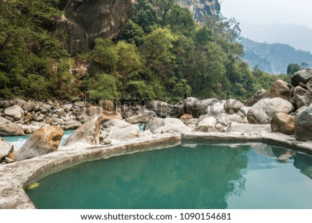 Natural hot spring in the Himalayas on a spring day, Nepal. 
