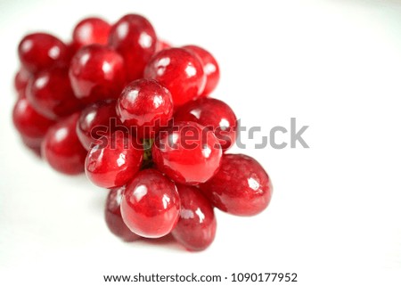 Bunch of ripe red grapes isolated on white