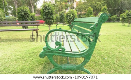 Park bench is a long seat made of wood or metal that two or more people can sit on, placed in a public place or open space in a town