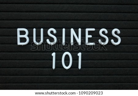 The words Business 101 in white plastic letters on a black letter board as an introduction to how to achieve success in the world of business