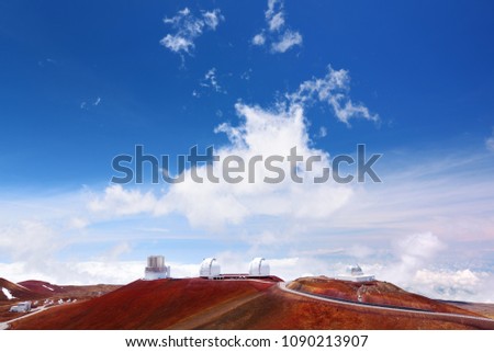 Observatories on top of Mauna Kea mountain peak. Astronomical research facilities and large telescope observatories located at the summit of Mauna Kea on the Big Island of Hawaii, United States