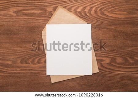 Envelope on wooden background    