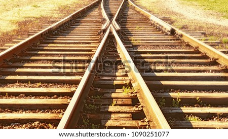 A railway track litted by the sun.