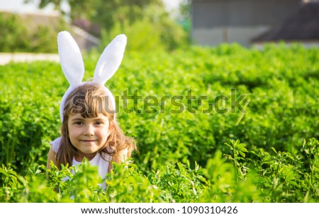 Child with rabbit ears. Easter. Selective focus. 