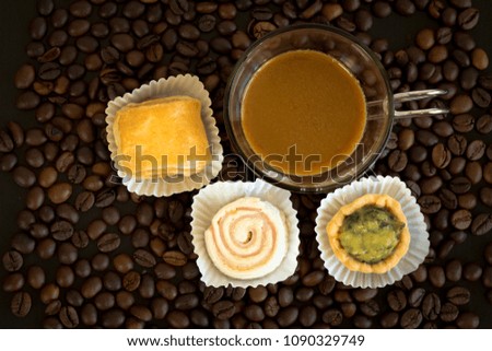 Bakery of Pie and Spinach cheese pie with coffee on coffee bean. Top view picture style