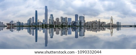 Guangzhou,China modern city skyline on the zhujiang river at dusk