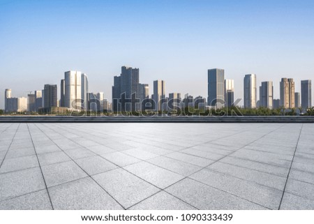 empty marble floor with modern office building in hangzhou city