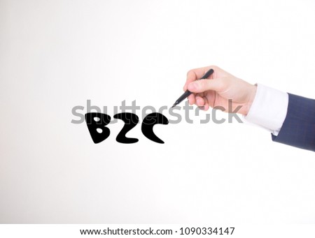 The businessman writes a black marker inscription:B2C