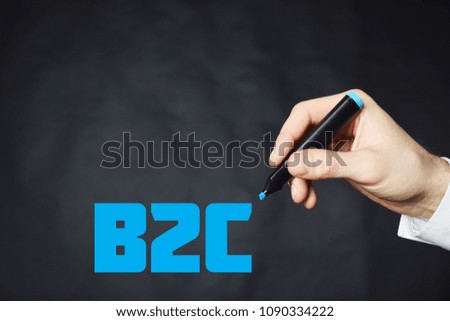 The businessman writes a blue marker inscription:B2C