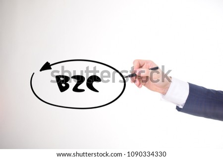The businessman writes a black marker inscription:B2C