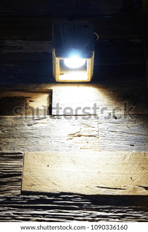 The light used to decorate the wood, the wall, the dim light, the top view.