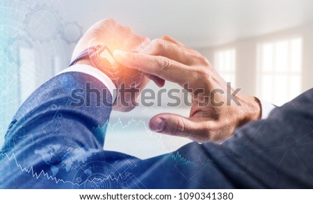 Businessman using his smart watch with bright glowing.