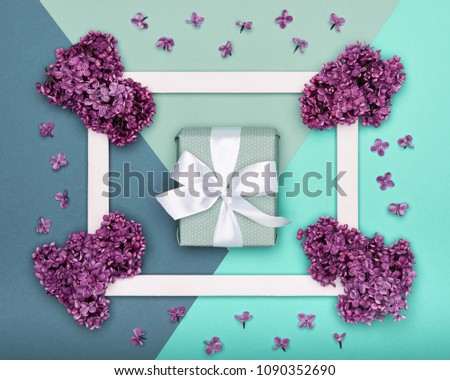 Happy Father's day or Birthday Pastel Candy Blue Colour Background. Floral flat lay greeting card with picture frame mock up and wrapped gift box.