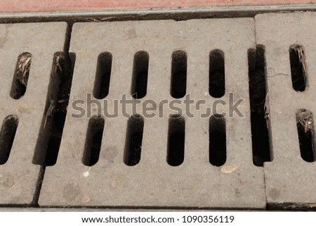 Sewer System Concrete Road Grid Grate Blocks For Drain Rain Water Photo Shot.