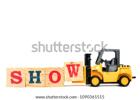 Toy forklift hold letter block W to complete word show on white background