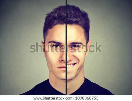 Bipolar disorder. Man with double face expression isolated on gray background Royalty-Free Stock Photo #1090368755