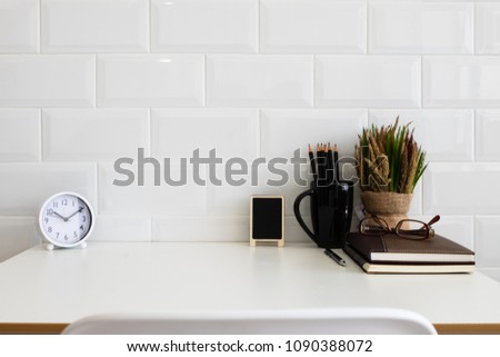 White desk table with copy space, supplies and coffee mug. Front view workspace and copy space