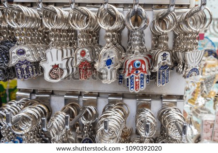 Hamsa keychains  with "Chai" symbol - "Living" sale at Carmel Market, popular marketplace in Tel-Aviv. Israel