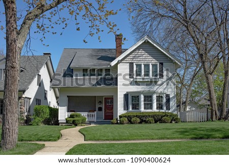 White Home with Curved Walk Royalty-Free Stock Photo #1090400624