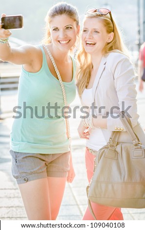Two woman taking a picture from themselves