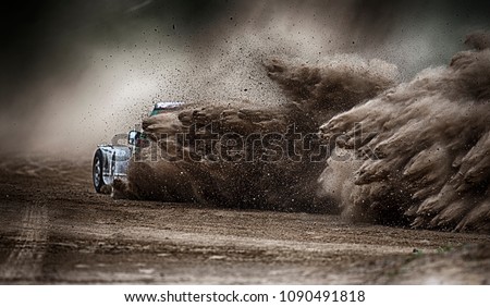 racing sports car in dust clubs on the track  , rally Royalty-Free Stock Photo #1090491818