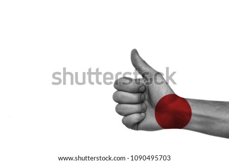 
painted thumb up in colors of the flag of japan