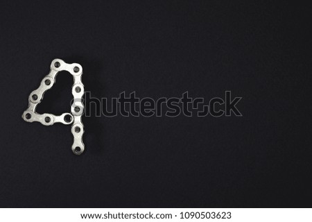 Iron bike chain showing numbers, ideal for your industry projects or mechanics publications.