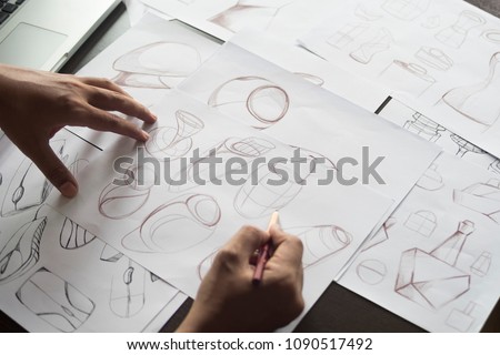 Production designer sketching Drawing Development prototype process Design idea Creative Concept Royalty-Free Stock Photo #1090517492