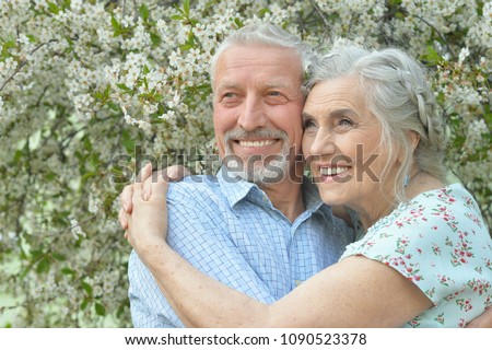 couple  hugging in  blooming garden 