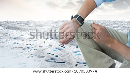 Businessman in sea of documents under sky clouds with watch