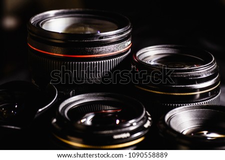 lenses from the dslr camera on a dark background (close)