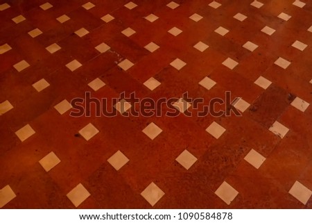 Red terracotta floor and white squares