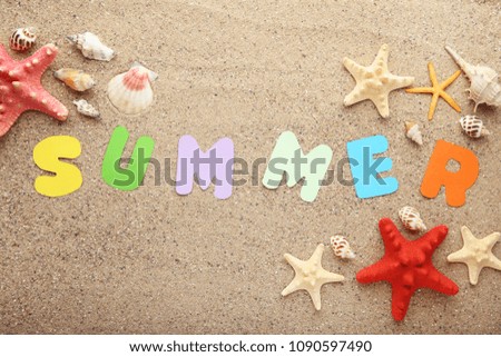 Inscription Summer with seashells on beach sand