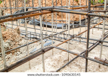 reinforcement of concrete with metal rods connected by wire. Preparation for pouring the Foundation