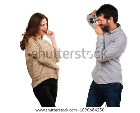 Young couple photographing