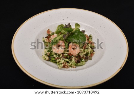 salad with salmon, cheese, and various seeds