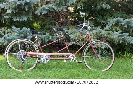 vintage bicycle built for two for fun and recreation Royalty-Free Stock Photo #109072832