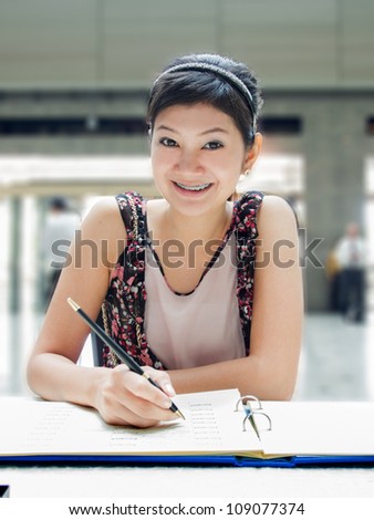 Thai Girl writing