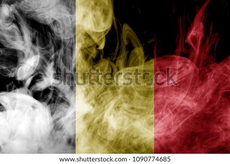 National flag of Belgium from thick colored smoke on a black isolated background