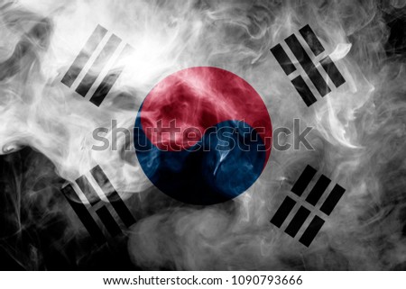 National flag of South Korea from thick colored smoke on a black isolated background