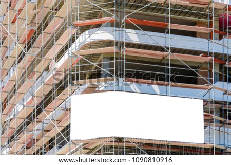 Blank space on a scaffolding building for your advertising. white mockup