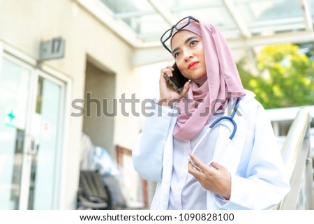 Veiled medical staff with blurred background.