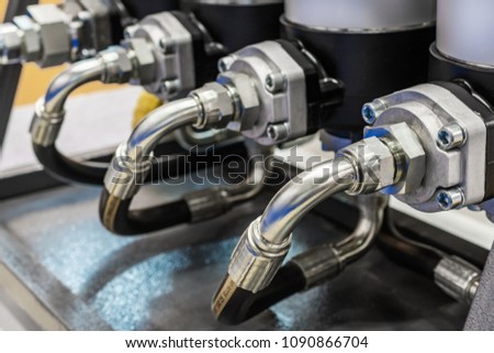 Several powerful hydraulic hoses. Hydraulic control system of equipment. Royalty-Free Stock Photo #1090866704